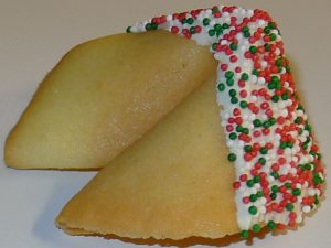 fortune cookie with white chocolate and red and green nonpareils