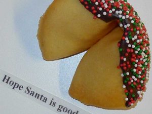 fortune cookie with chocolate and red and green sprinkles