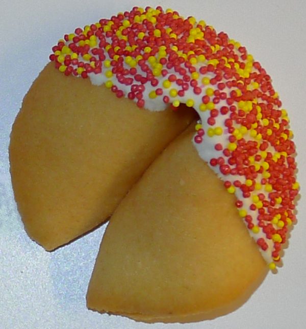 fortune cookie with white frosting and sprinkles